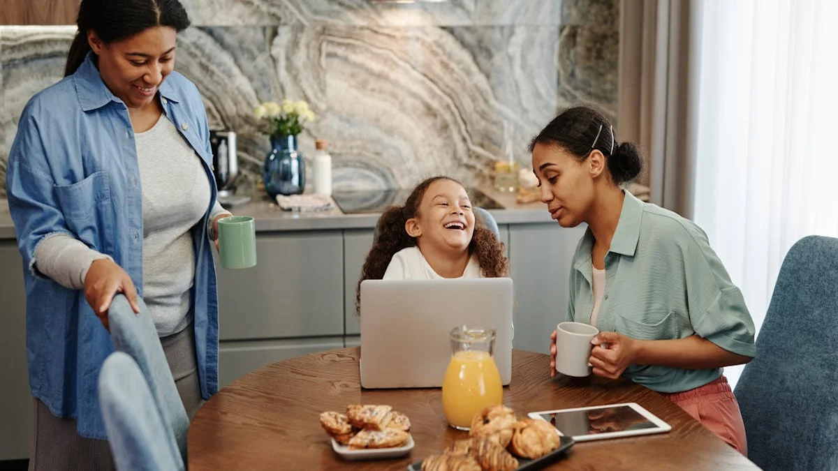 Parent and child reviewing a chore chart together on a tablet at the kitchen table