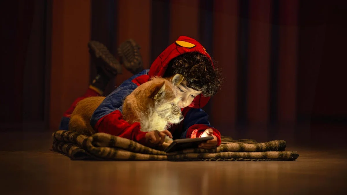 A child focused on a tablet in a cozy, offline setting