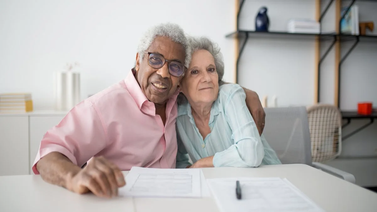 A senior couple calmly discussing a document at their kitchen table